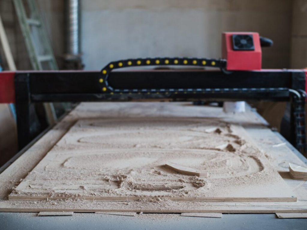 Automated cutting CNC machine in wood work shop